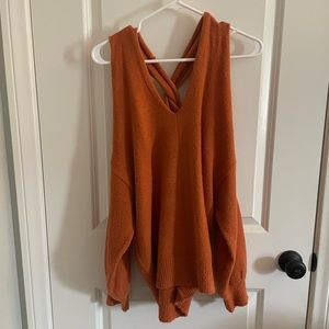 Burnt orange cross back sweater from Fashion Nova